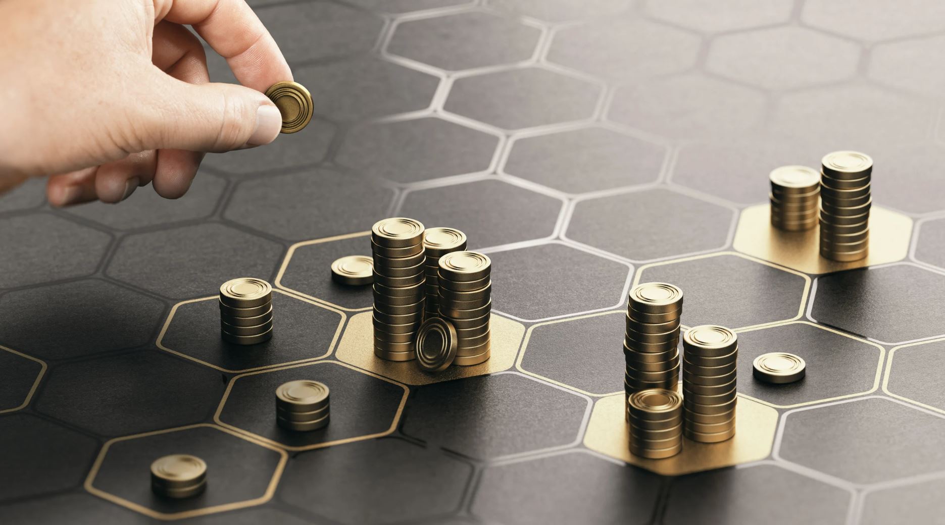 A close-up image of a hand placing a gold coin on a hexagonal game board, featuring stacks of coins arranged in various formations. The board has a dark background with hexagonal patterns, highlighting the strategic placement of coins. This image represents concepts of strategy and resource management in gaming or financial contexts.